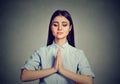 Woman meditating taking a pause from all errands