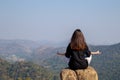 Woman meditating yoga at mountains, practices meditation, serenity, Lifestyle relaxation, Emotional, Outdoor harmony with nature Royalty Free Stock Photo