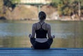 Woman meditating in yoga pose by Cultus Lake British Columbia Royalty Free Stock Photo