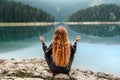 Woman Meditating in Yoga Pose by Mountain Lake Royalty Free Stock Photo