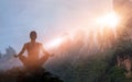 Woman meditating yoga at sunset mountains with nature. Outdoor s