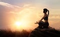 Woman meditating yoga at sunset mountains with nature. Outdoor s