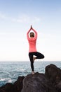 Woman meditating in yoga vrksasana tree pose Royalty Free Stock Photo