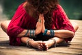 Woman in a meditative yoga position closeup