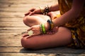 Woman in a meditative yoga position outdoor lower body