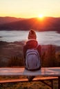 Woman meet autumn morning in mountain landscape at sunrise Royalty Free Stock Photo