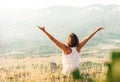 Woman meets sunrise in mountain Royalty Free Stock Photo