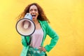 Woman, megaphone and announcement on yellow background of speech, review and mockup. Female, attention and voice for