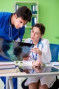 The woman and man doctors radiologists working at the clinic