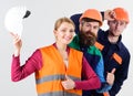 Woman and men holds hard hats. Best team concept. Royalty Free Stock Photo