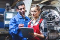 Woman and man manufacturing worker in discussion