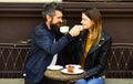 Woman and man with smiling faces have date at cafe. Royalty Free Stock Photo