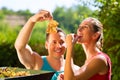 Woman and man working with grape harvesting machine Royalty Free Stock Photo