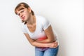 Woman with menstrual pain is holding her aching belly Royalty Free Stock Photo