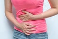 Woman with menstrual pain is holding her aching belly Royalty Free Stock Photo