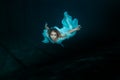 Woman mermaid under water.