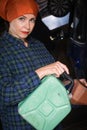 Woman with metallic canister filling car tank