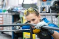 Woman metalworker checking the accuracy of her work