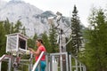 Woman meteorologist reading meteodata in mountain weather station