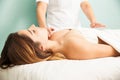 Woman in the middle of a reiki therapy session