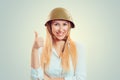 Woman in military helmet showing like thumb up