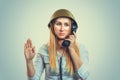 Woman in military helmet talking at phone giving her salute to fuhrer Royalty Free Stock Photo