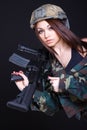 Woman in the military uniform with an assault rifle on the shoulder Royalty Free Stock Photo