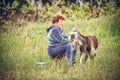 Woman milking a goat