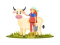 Woman milkmaid with cow, collects milk. Agronomist engaged in household