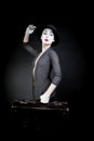 Woman mime in hat with suitcase