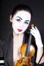 Woman mime with old violin Royalty Free Stock Photo