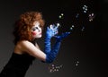 Woman mime with theatrical makeup and soap bubbles. Royalty Free Stock Photo