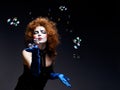 Woman mime with theatrical makeup and soap bubbles. Royalty Free Stock Photo