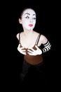 Woman mime in white gloves