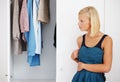 Woman, mirror or choosing clothes in closet for morning routine, fashion or clothing in bedroom of home. Person, outfit