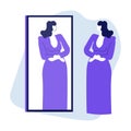Woman looking at mirror reflection and trying on evening dress Royalty Free Stock Photo