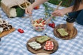 Woman mix vegan salad on picnic outside. Vegan food concept Royalty Free Stock Photo