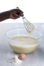 Woman mixing cake ingredients in a mixing bowl