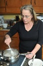 Woman mixing food in kitchen