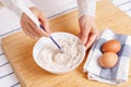 Woman mixing ground flaxseed and flour