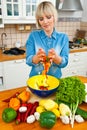 Woman mixing vegetables