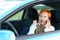Woman with mobile in a car Royalty Free Stock Photo