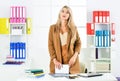 Woman with mobile phone in office. millennial girl browsing internet. attractive businesswoman using digital tablet Royalty Free Stock Photo