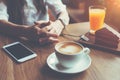 Woman with mobile phone on the table, texting in social media, breakfast of handsome business lady Royalty Free Stock Photo