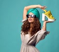 Woman in modern cat eyes sunglasses with white yellow shoe Royalty Free Stock Photo