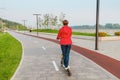 Woman with modern electric sharing scooter. Urban Lifestyle and transport concept