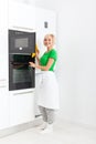 Woman modern kitchen appliance setting Royalty Free Stock Photo