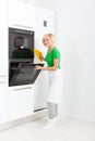 Woman modern kitchen appliance setting Royalty Free Stock Photo