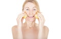 Woman moistens face with fresh apple halves
