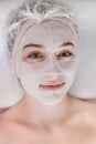 Woman in moisturizing anti-wrinkle mask. A woman is lying down, resting in a beauty salon. SPA procedures at home or in